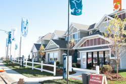 The front of three show homes in new community Starling at Big Lake